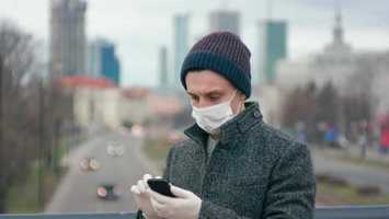 Free download Coronavirus Pandemic: Man in Medical Mask and Gloves Uses App on Smartphone | Stock Footage - Videohive video and edit with RedcoolMedia movie maker MovieStudio video editor online and AudioStudio audio editor onlin