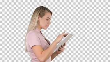 Free download Girl holding digital tablet searching for something, Alpha Channel | Stock Footage - Videohive video and edit with RedcoolMedia movie maker MovieStudio video editor online and AudioStudio audio editor onlin