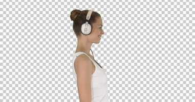 Free download Happy casual girl wearing headphones walking, Alpha Channel | Stock Footage - Envato elements video and edit with RedcoolMedia movie maker MovieStudio video editor online and AudioStudio audio editor onlin