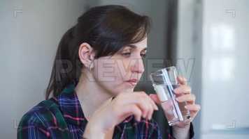 Free download Woman Takes A Pill Stock Video video and edit with RedcoolMedia movie maker MovieStudio video editor online and AudioStudio audio editor onlin