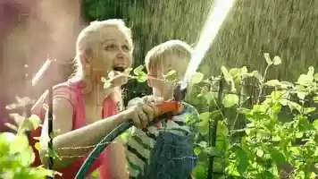 Free download Mom And Son Watering Flowers Stock Video video and edit with RedcoolMedia movie maker MovieStudio video editor online and AudioStudio audio editor onlin