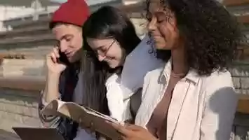 Free download Teenagers outdoors doing homework and laughing. Boy is | Stock Footage - Videohive video and edit with RedcoolMedia movie maker MovieStudio video editor online and AudioStudio audio editor onlin