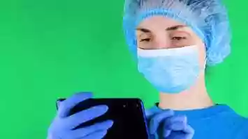 Free download Woman Doctor Holding Phone with Green Screen Up To Camera for Compositing | Stock Footage - Videohive video and edit with RedcoolMedia movie maker MovieStudio video editor online and AudioStudio audio editor onlin